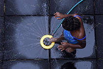 girl playing in fountain
